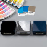 Private_Label_-_square_device_component_samples_showing_matte_black_high_gloss_chrome_and_metallic_blue_surface_finishes_with_pantone_cards-Pages-Ecozy