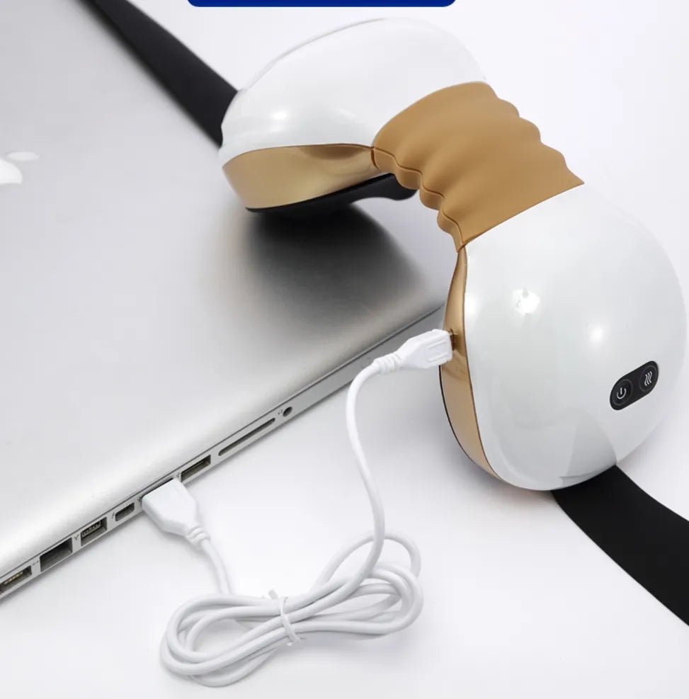 Neck Massager with Heat White and gold neck massager connected to a laptop via a white USB cable for charging.