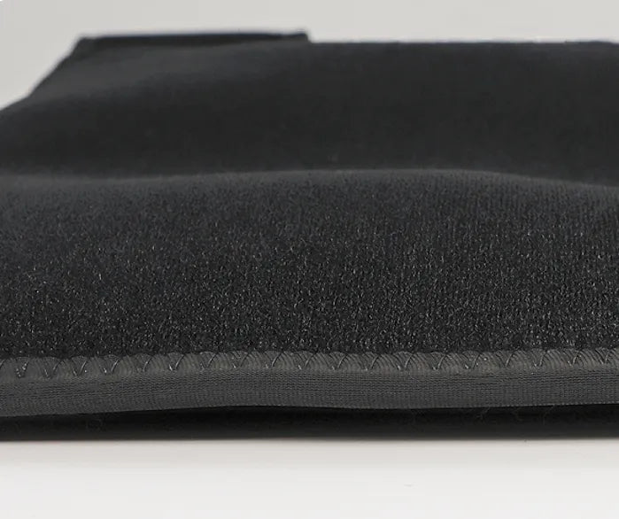 Infrared Hot Wave Leg Massager Close-up view of the black fabric material and stitched edge of the leg massager.