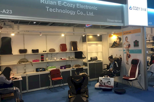 Our_Story_-_early_trade_show_booth_of_Ruian_Ecozy_Electronic_Technology_showcasing_vintage_back_massager_cushions-Pages-Ecozy