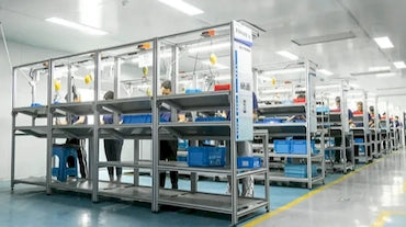 Wholesale-factory-assembly-line-workers-manufacturing-massage-equipment-in-cleanroom-workshop-Pages-Ecozy-phone