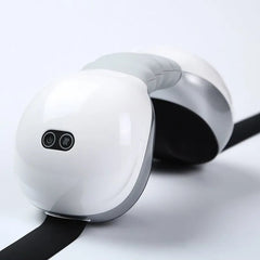 Neck Massager with Heat Side profile of a white neck massager with a grey flexible center and control buttons.