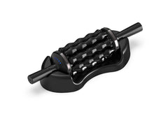 Rolling Percussive Massager Silver and black rolling percussive massager resting on a black base against a white background.